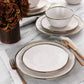 Elama Modern 16 pc Stoneware Dinnerware Set in Matte White w Gold Rim