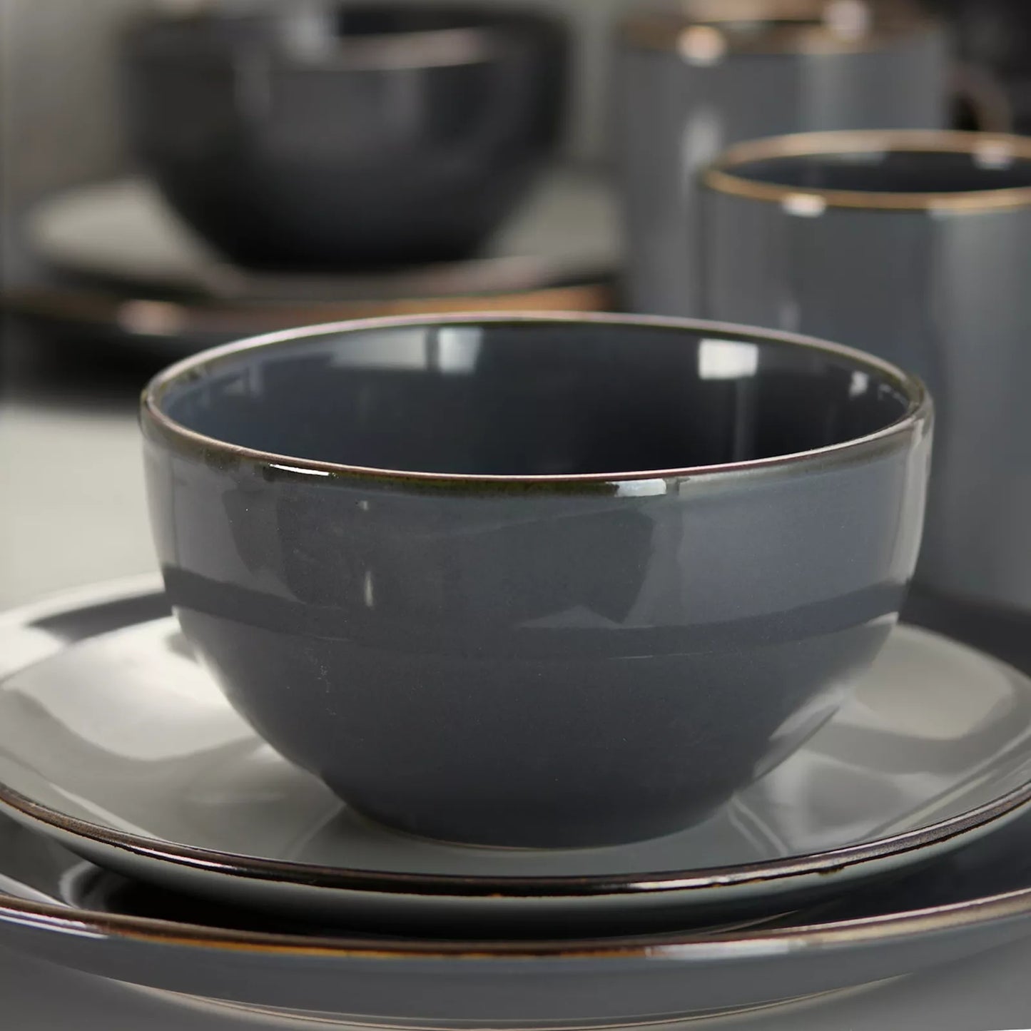 Elama Tahitian Grand 16 Piece Stoneware Dinnerware Set for 4 in Gray High Gloss